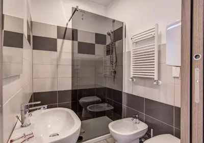 a bathroom with a sink and a toilet at Floor 6 Boutique Rooms by DOT Suites in Rome