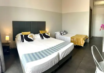 a hotel room with two beds in a room at Floor 6 Boutique Rooms by DOT Suites in Rome