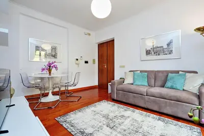 a living room with a couch and a table at Mecenate Charme Apartment in Rome