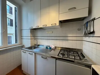 a kitchen with a sink and a stove in it at House Maximo near Vatican in Rome