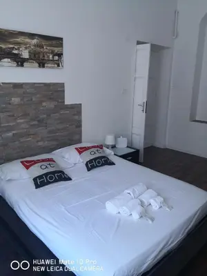 a bedroom with a large bed with towels on it at Trastevere four seasons Valadier in Rome