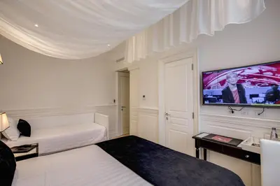 a white door with two lights on top of it at Hotel Tito in Rome