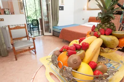 a bowl of fruit on a table in a room at Suites Oliveri Viale Marconi in Rome