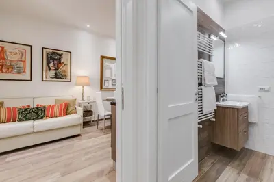 a living room with a couch and a table at AS Vaticano Apartment in Rome