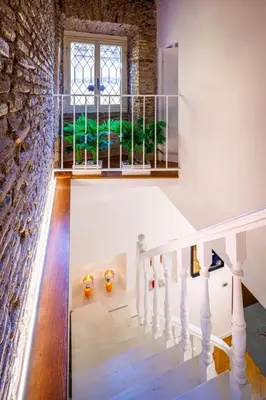 a staircase in a house with a window at Romanticasa Trastevere in Rome