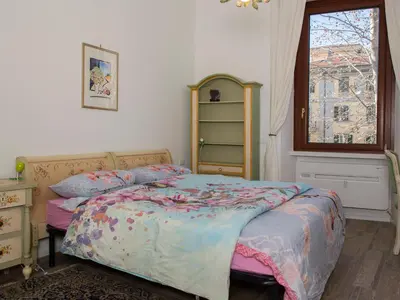 a bedroom with a bed and a window at The Apartments - Vatican in Rome
