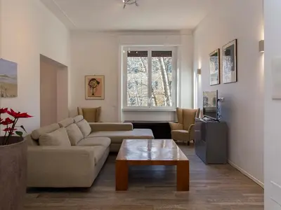 a living room with a couch and a coffee table at The Apartments - Vatican in Rome