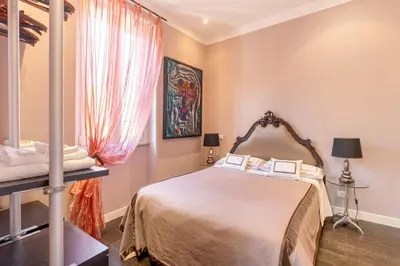 a bedroom with a bed and a window at Atmosphera Trastevere, Glamour apartment in the center in Rome