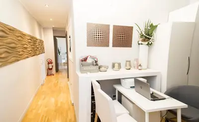 a small office with a desk and a laptop at Corso Experience in Rome