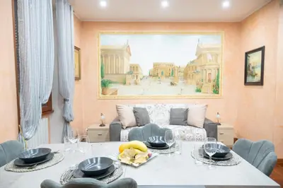 a living room with a table and a couch at ROMA18 in Rome