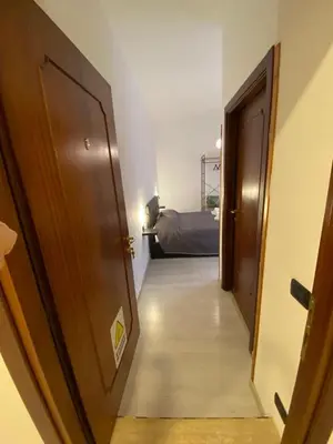 a hallway with a door leading to a bedroom at Floreo Guest House in Rome