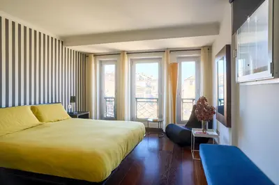 a hotel room with a bed and a balcony at La Mia Casa in Campo di Fiori in Rome