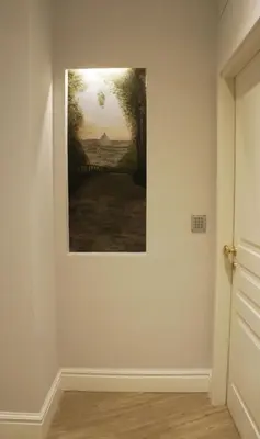 a painting hanging on a wall in a room at Roman Suite Guest House in Rome