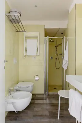 a bathroom with a tub and a sink and a toilet at Rhome Accomodation in Rome