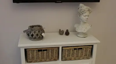 a white shelf with a bust and vases on it at La Cupola Suite in Rome