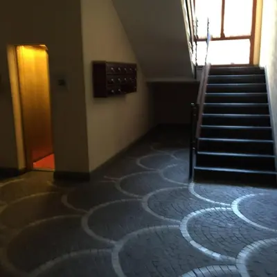 a room with a spiral carpet on the floor at La Cupola Suite in Rome