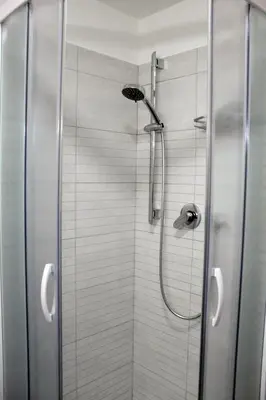 a shower with a glass door in a bathroom at Arcadia Domus in Rome