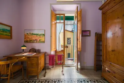a home office with a desk and a window at Colosseo Holiday House in Rome