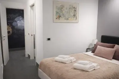 a bedroom with a bed with two towels on it at Saint Peter Basilica 200m- 2BR -2BA -Sleeps 6 in Rome