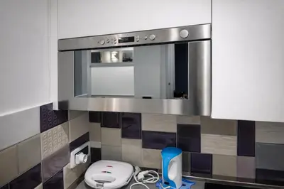 a bathroom with a sink with a toilet and a mirror at Saint Peter Basilica 200m- 2BR -2BA -Sleeps 6 in Rome