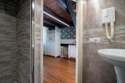 a bathroom with a toilet and a sink at Casa Trasteverina in Rome