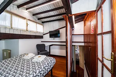 a small room with a bed and a chair at Casa Trasteverina in Rome