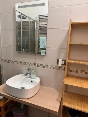 a bathroom with a sink and a mirror at Mio House Vatican in Rome