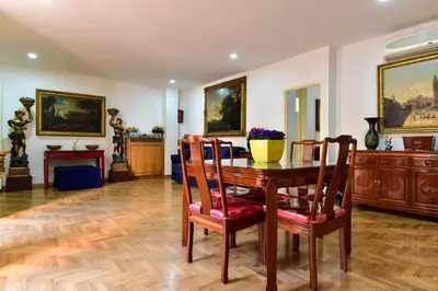 a dining room with a table and chairs at Elite Rome Apartments in Rome