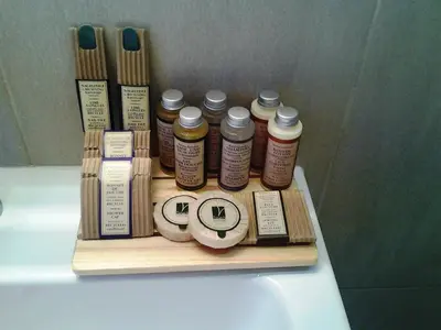 a wooden tray with various items on top of a bath tub at Roma Borgo91 in Rome