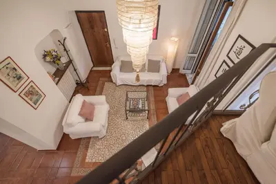 an overhead view of a living room with white furniture at Vatican Luxury Terrace in Rome