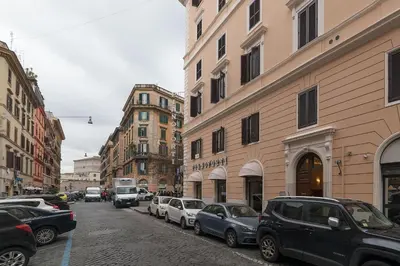 a busy city street with cars parked on the street at Vatican Luxury Terrace in Rome