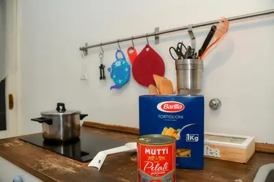 a counter top with a can of nutella on a stove at Saint Peter House Germanico in Rome