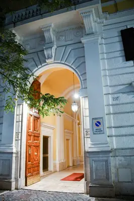an archway in a building with a wooden door at Saint Peter House Germanico in Rome