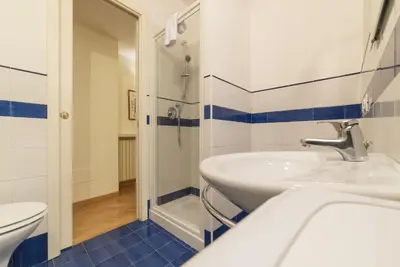 a bathroom with a sink and a toilet at Casa Cornacchie - FromHometoRome in Rome