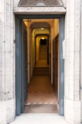 an empty hallway with stairs in a building at Tritone 91 Apartments in Rome