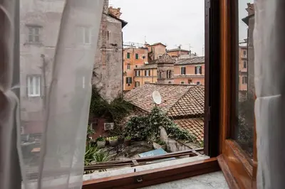 a view of a city from a window at Magia in Trastevere in Rome