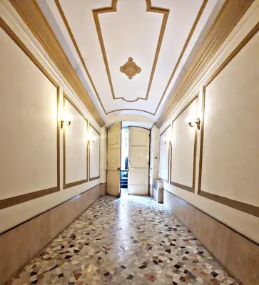 a corridor of a building with a coffered ceiling at Fabio Massimo Guest House in Rome