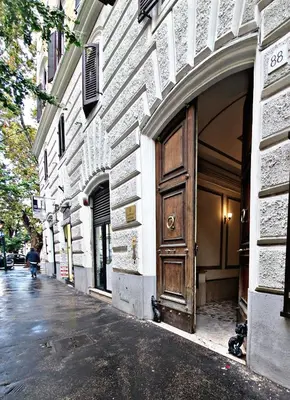 a wooden door on the side of a building at Fabio Massimo Guest House in Rome