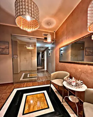 a living room with a table and chairs at Fabio Massimo Guest House in Rome