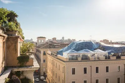 a building with a glass dome on top of it at Dopodomani Suite in Rome