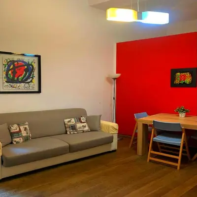 a living room with a couch and a table at Sforza Apartment in Rome