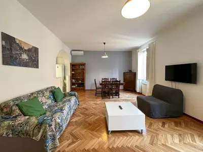 a living room with a couch and a table at Vatican Charming Suite in Rome