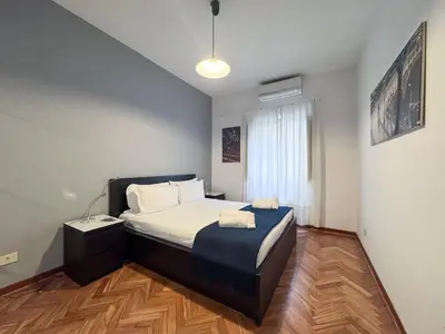 a bedroom with a bed with two towels on it at Vatican Charming Suite in Rome