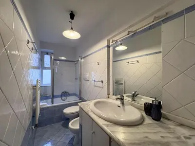 a bathroom with a sink and a toilet at Vatican Charming Suite in Rome