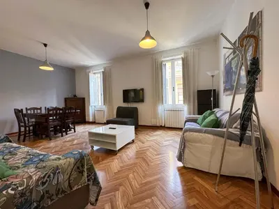 a living room with a couch and a table at Vatican Charming Suite in Rome