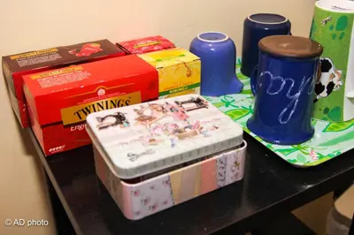 a table topped with a wii remote and some boxes at Homesuitehome in Rome