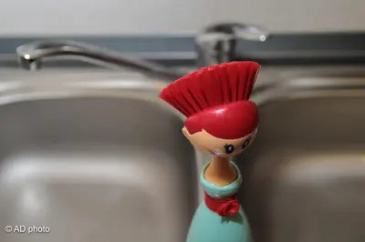 a toy doll with a red head and a faucet at Homesuitehome in Rome
