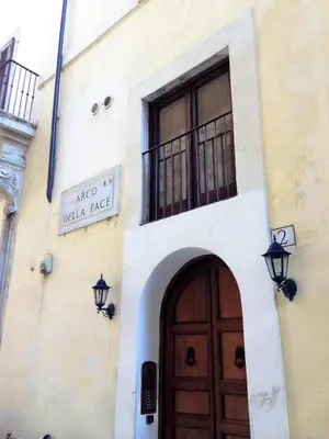 an entrance to a building with a wooden door at Navona Secret Suite in Rome