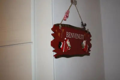 a sign that reads benjaminbush hanging on a door at Navona Secret Suite in Rome