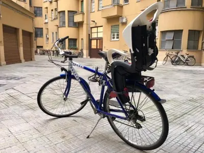 a bike parked on a street with a parking meter at Bed&BikeRome Suite in Rome